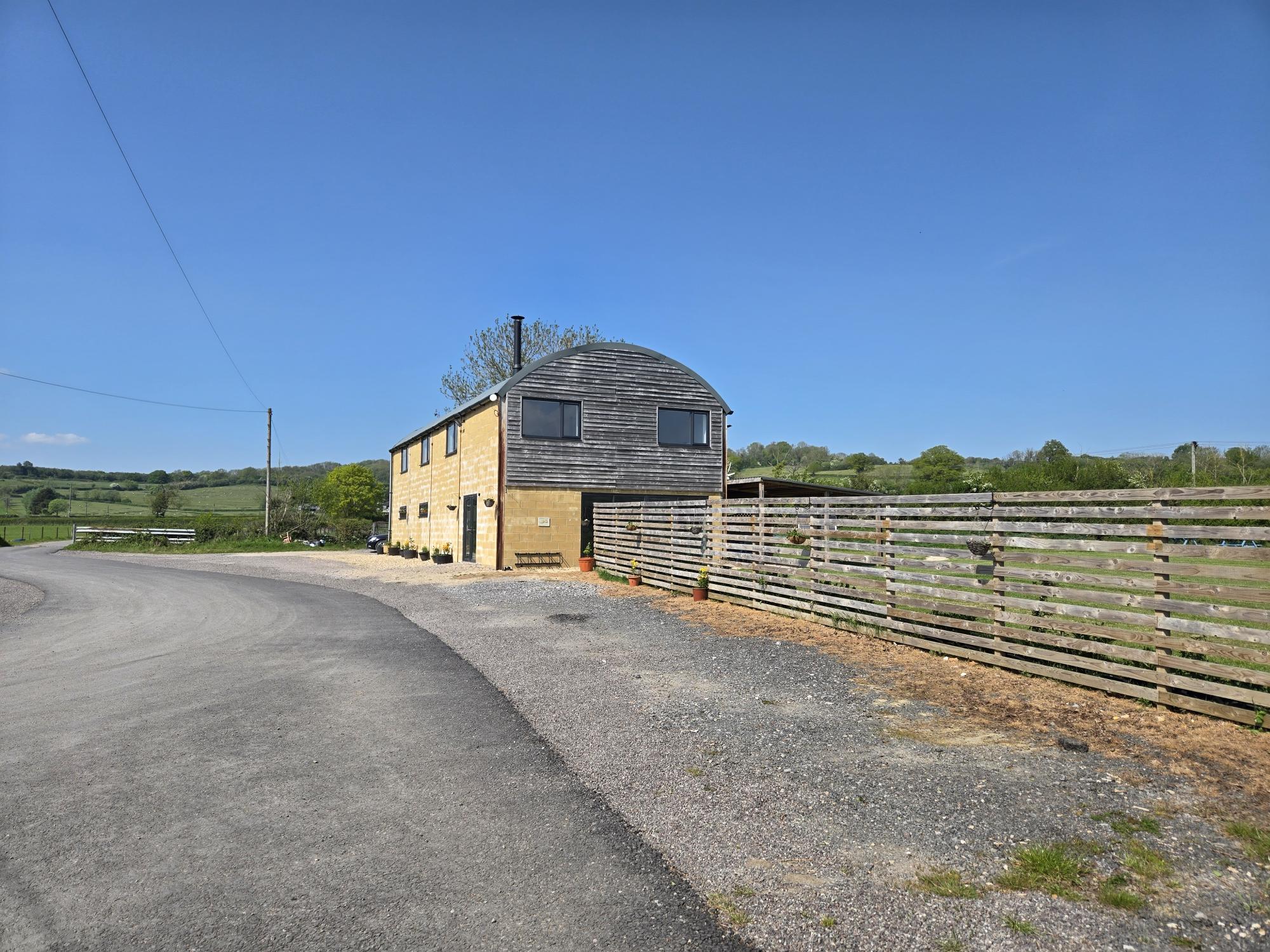 Barn exterior and parking area